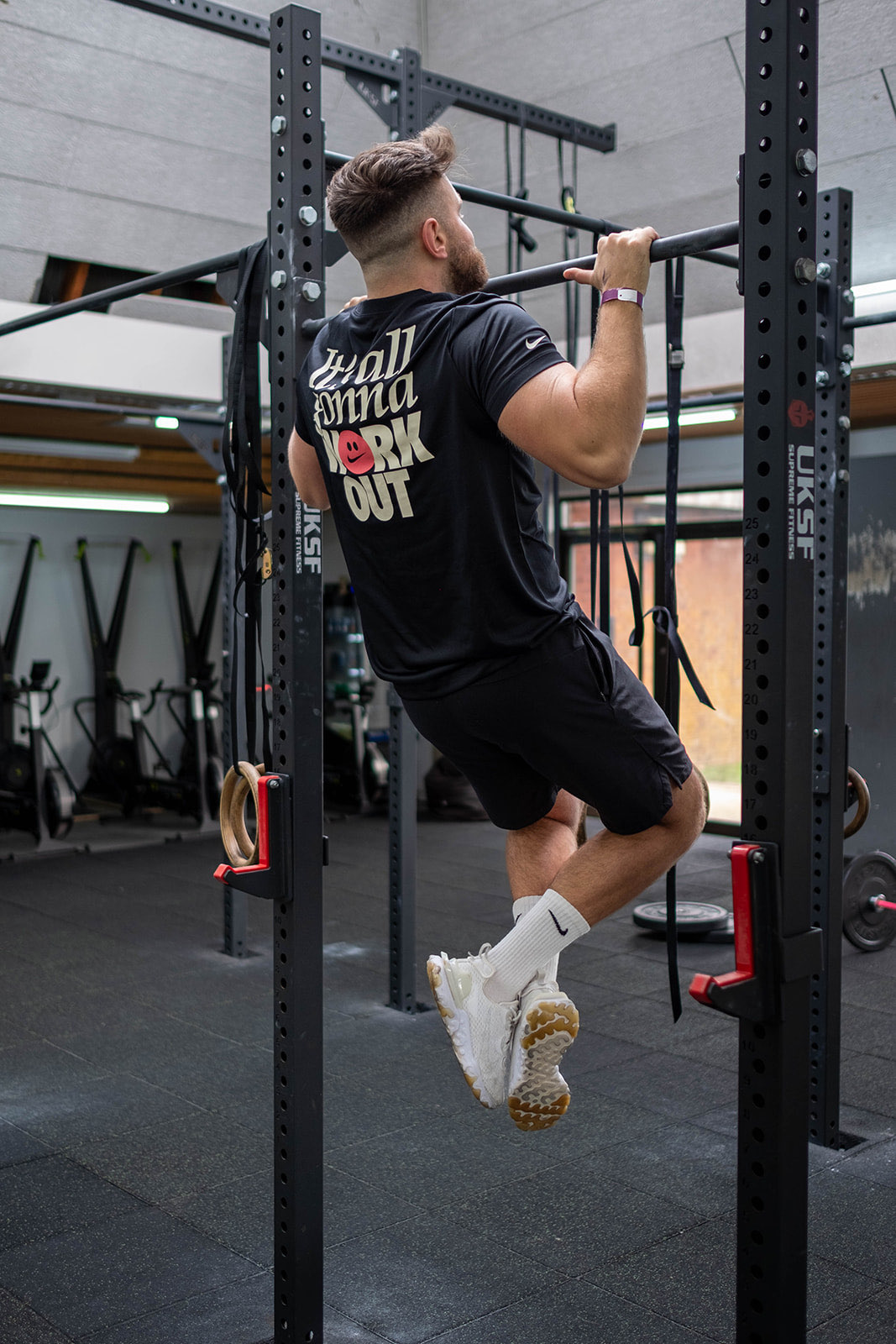 Ryan performing a pull up in the gym